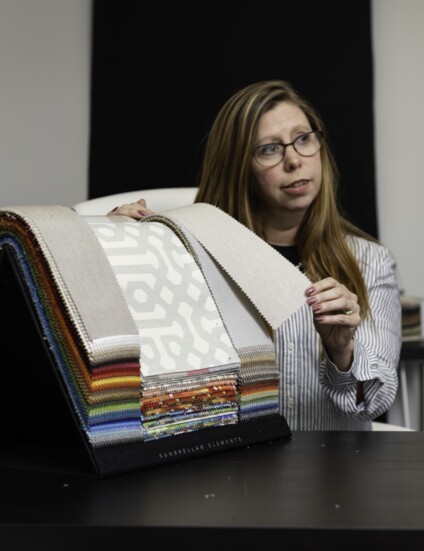 Erin Tice presenting Atlanta BedSwing's custom fabric selection.