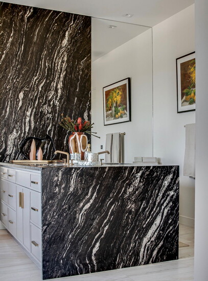 Master Vanity has the "Waterfall" feature extended vertically from ceiling down to vanity and floor in leathered granite