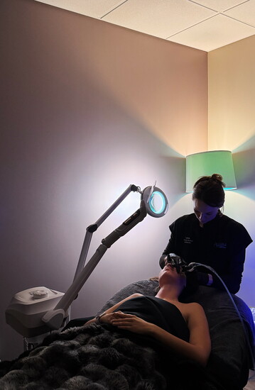 Medical Aesthetician Lana Leslie doing a DiamondGlow on a client