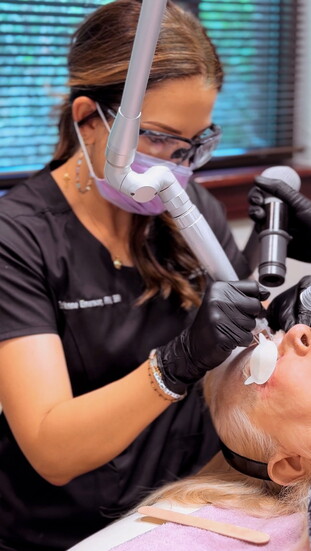 Provider Brianne Emerson, RN, BSN, doing a CO2 laser on a client at Allura