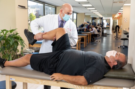 Patient Terry Degennaro with Dr. Nayfeh, undergoes physical therapy at MOST.