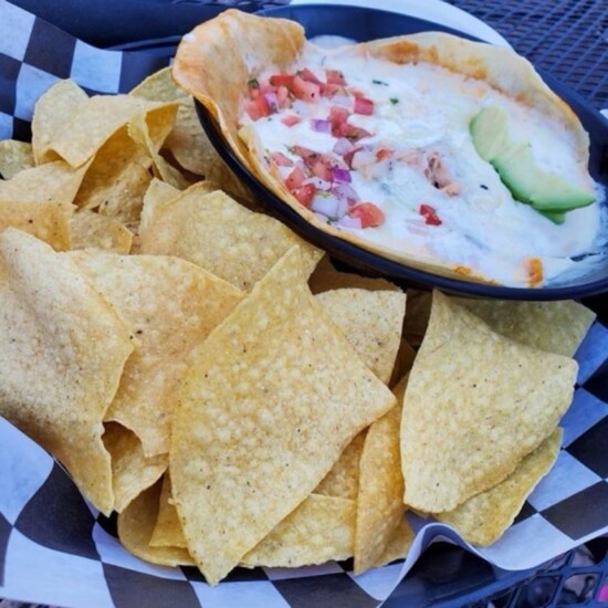 Deep Deuce Grill's Enchilada Dip is a perfect dish for the patio!