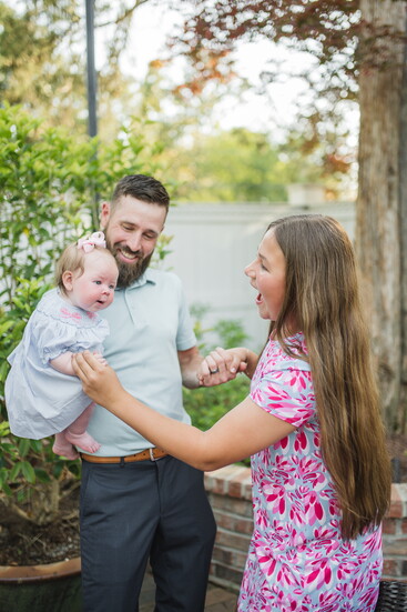 John McFall dances with his daughters