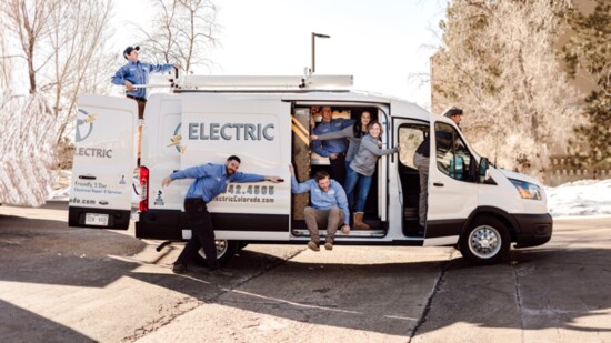 Tesla Electric Co. team in enjoys a light moment, but takes it work seriously.