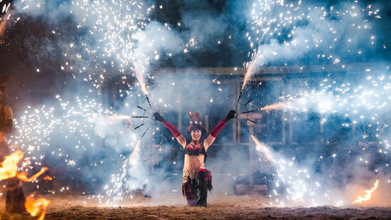 Spectacular pyrotechnic dance lights the evening sky.