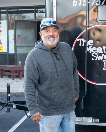 Meat Sweats owner Martin Tudon poses by his food truck at a fundraiser.
