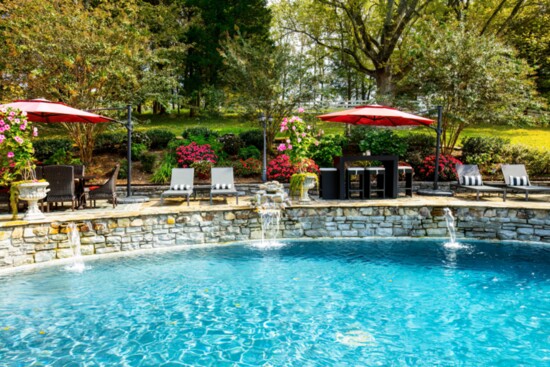 The beautifully-landscaped pool area is an inviting place for guests.