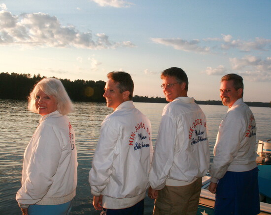 Mom and sons in waterski show jackets