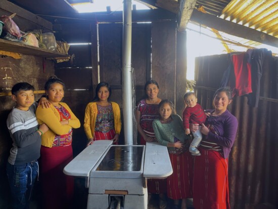 This Guatemalan family most likely worked for years to save the $40 needed to contribute to receiving a new stove (seen here) and water filter from HELPS Int’l.