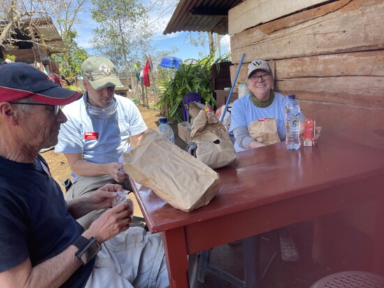 Teresa happily enjoying lunch with other volunteers in Guatemala.