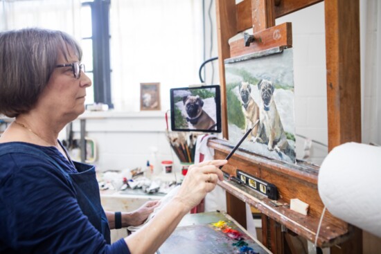 An artist shares her process while hard at work on a painting.