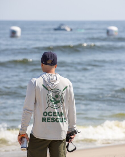 Kyle Arcomano keeps an eye on the surf competition.