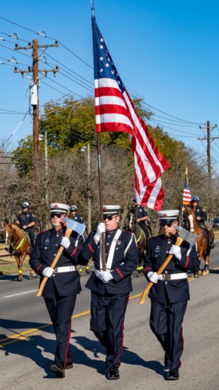 The Hendersonville Fire Department Honor Guard marches during the 2023 Veterans Day parade.