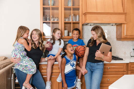 Brooke Yobo and Lindsay Keyser with their children