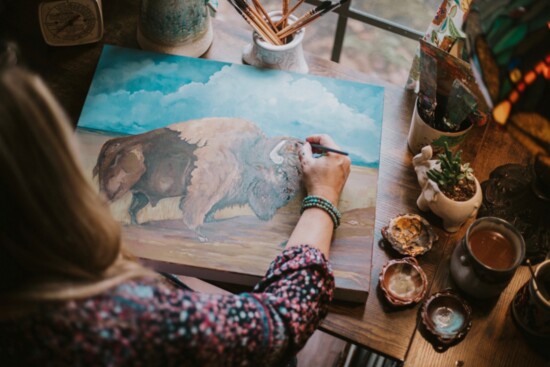 Painting her inspirational Bison