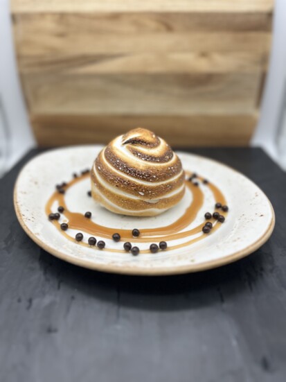 S’mores Baked Alaska, Graham cracker cake, chocolate ice cream, toasted meringue, salted caramel, dark chocolate pearls