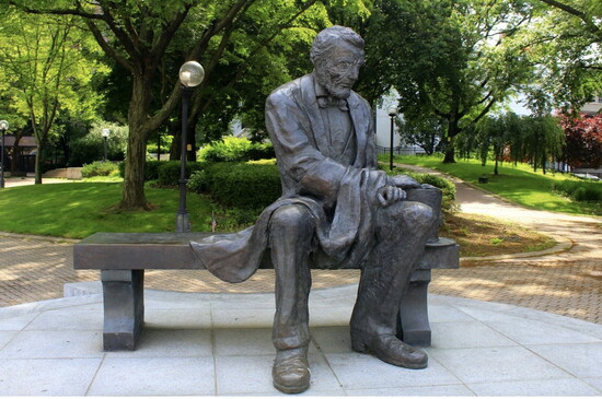 Lincoln by artist John Blair sits in Veterans Park