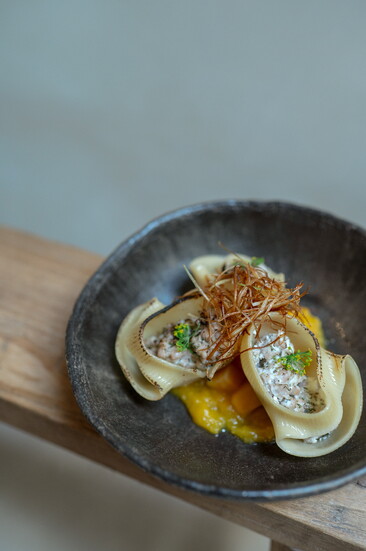 Stuffed pasta with Berkshire pork and goat cheese over butternut squash 