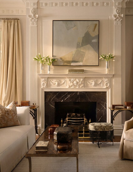 Antique tables from the client’s collection flank the fireplace. A sofa designed by Bobby McAlpine for the Catbird Collection–a furniture line created in 