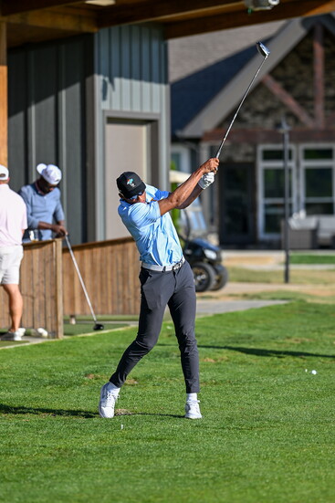 Joshua Dobbs warming up on the practice tees at Tennessee National