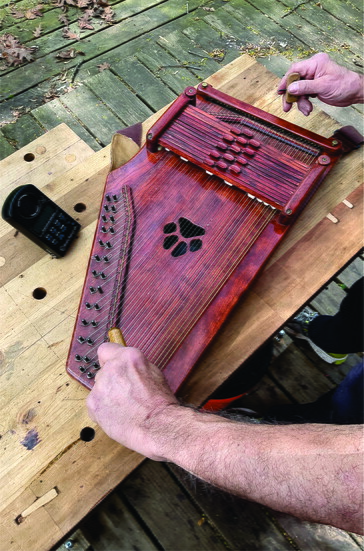 Luthier Ricky tunes Autoharp