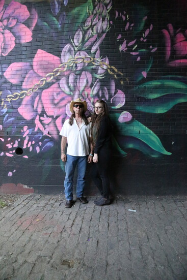 In front of a Jersey City mural