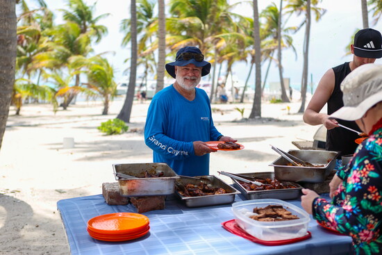 David sampling the BBQ on Half-Moon Caye
