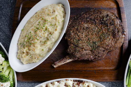 Photo Credit: Lauren Holub Photography Chairman’s Reserve Gourmet Ranch Bone-in Ribeye with garlic mashed potatoes. 