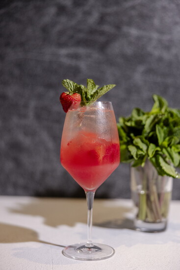 Photo Credit: Lauren Holub Photography Strawberry fields – Tito’s vodka, St. Germaine, lime, hibiscus and strawberry. 