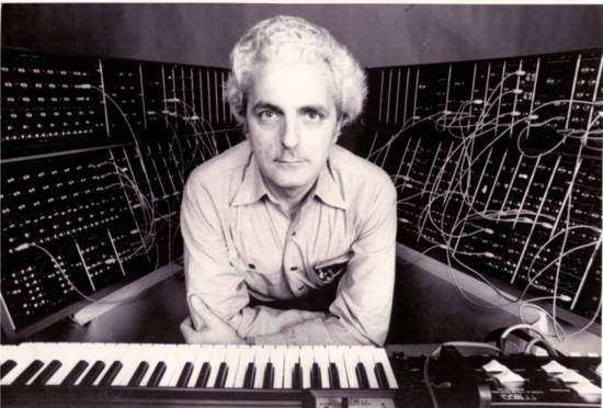 Bob Moog leaning over Roger Powell Keyboard