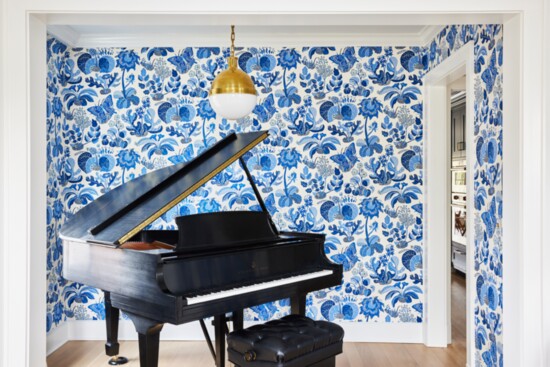 A piano room designed by Lauren Stark and AJ Howard. The wallpaper is A striking piano room by Stark & Howard. Photo by Julia D'Agostino.