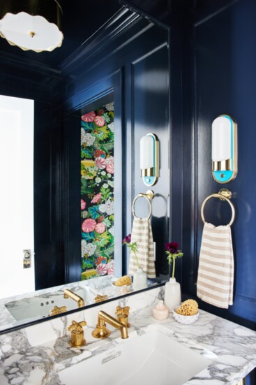 A custom sconce in a powder room designed by Stark & Howard. Photo by Julia D'Agostino.