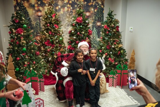 Families meeting Santa at the Bradenton Dream Center Christmas Dreamland