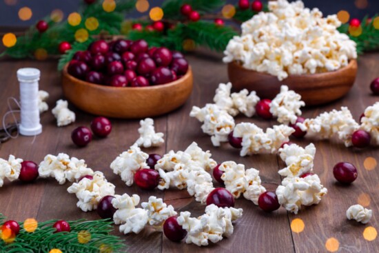 Popcorn and cranberries can be strung together with needles and thread to create an old-fashioned garland for Christmas trees. 