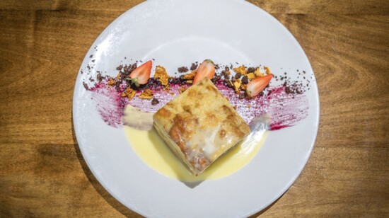 Housemade bread pudding with creme anglais, dark chocolate and market berries.