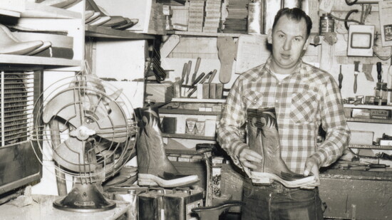 A bootmaker shows off his workshop and a handsome pair of cowboy boots.