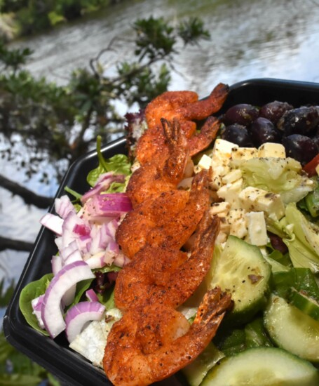 The "Big Snook Camp Salad" topped with blackened shrimp.