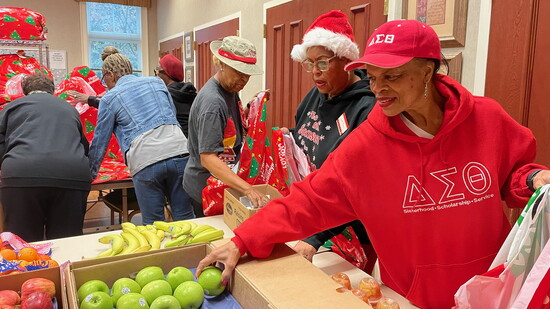 “Delta Dears” packing fruit baskets and Christmas gifts and the Fayette Senior Center