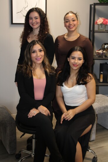 Lash and Glow's staff, clockwise from bottom left, Carla Peralta, Jordan Galvin, Louisette Davila and Yennifer Ibanez .
