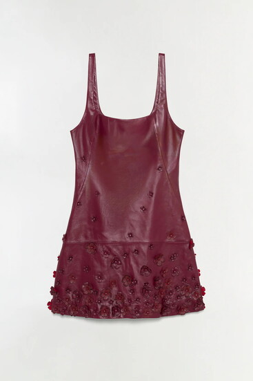 SIMKHAI’s Talen leather mini dress in fig, finished with tonal floral appliqués