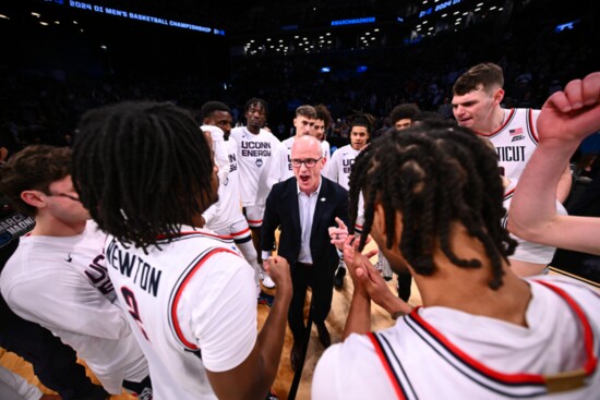 Coach Hurley with UConn men's basketball team members.