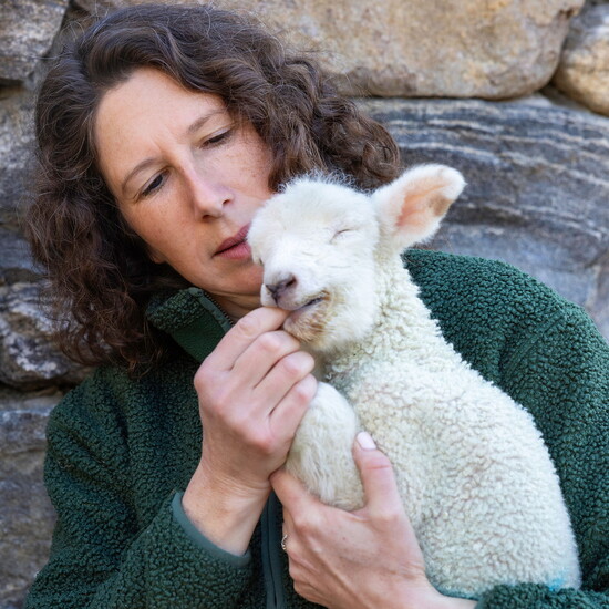 Whitney with a newborn lamb
