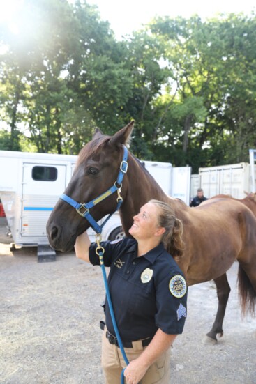 Sgt. Vickie Dills, supervisor of the Metropolitan Nashville Police Department's Horse Mounted Patrol, with Flint.
