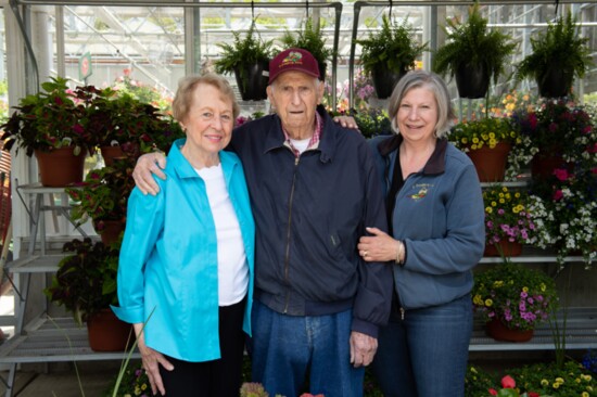 Sandy & Gino Draghi with their daughter, Cheryl Martin, inside one of the greenhouses. 