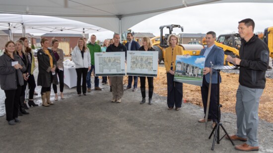 The Gatherings at Indian Lake design and construction team display architectural renderings at the official groundbreaking ceremony held on Nov. 1, 2018.