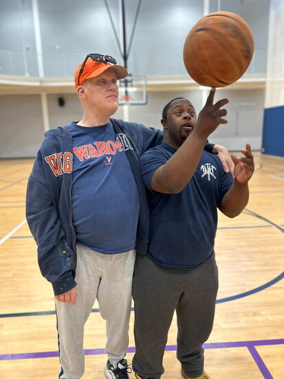 Jason and Darrius playing basketball. Photo Credit: The Arc of the Piedmont.