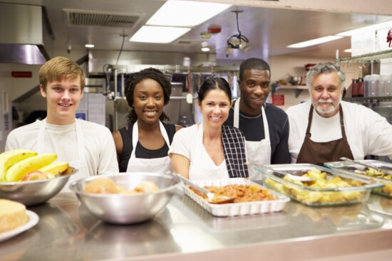 Volunteering in the kitchen can simultaneously teach children cooking skills and empathy.