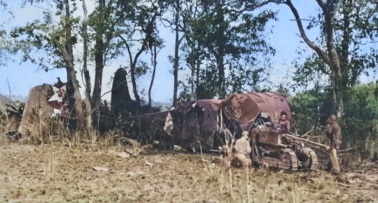 A crashed glider with an in-tact bulldozer in the China, India, Burma Theater (CBI).