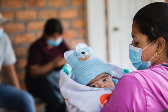 Patients and family members waiting for treatment.