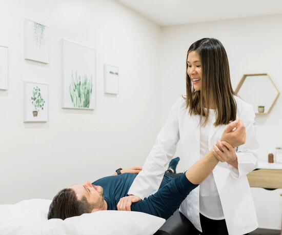 Providing hands-on care to a patient.